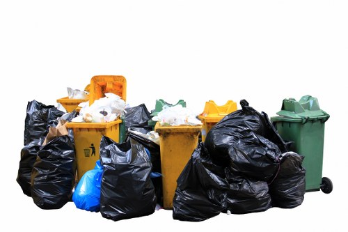 Family using a domestic skip for home renovation waste in Kingston