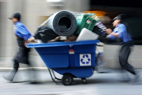 Workers segregating construction debris for recycling